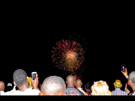 Fireworks light up the night skies as patrons ring in 2020 on the waterfront in downtown Kingston during the last staging of the event.