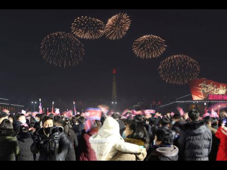 Fireworks explode to celebrate the New Year at Kim Il Sung Square in Pyongyang, North Korea.