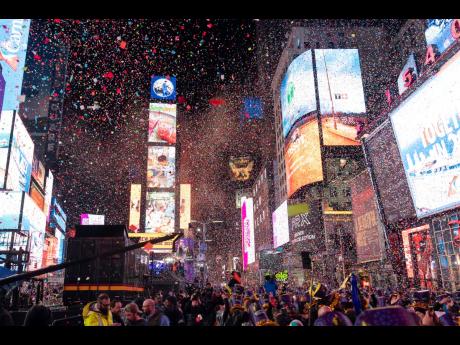 Confetti falls at midnight on the Times Square New Year’s celebration in New York in the United States.