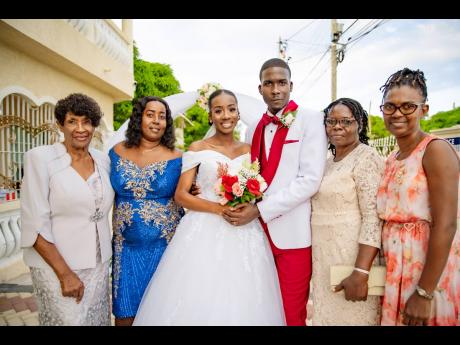 The happily married couple (centre) were excited to celebrate their matrimonial union with loved ones. From left: Olive McCalla, Taralee’s godmother; Paulette Currie, Taralee’s mother; Sybil Osbourne-Manning, Dwayne’s mother, and Jacqueline Forbes, T