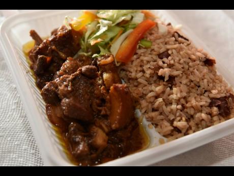 If you are a pork lover, then indulge in this brown stewed pork with rice and peas and steamed vegetables.
