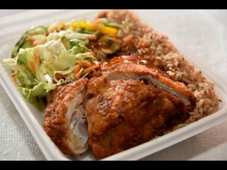 This country-style fried chicken, with rice and peas and vegetables gives you a taste of home.