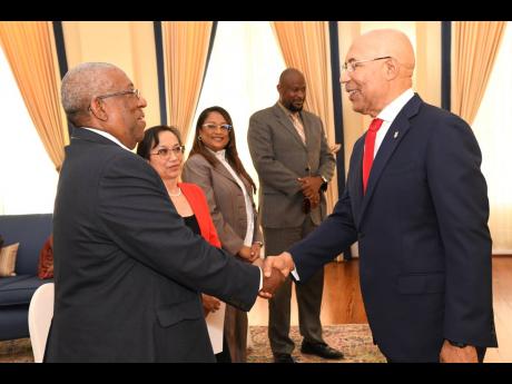 Governor General Sir Patrick Allen (right) greets (from left) Professor Dale Webber, pro vice-chancellor and principal of The University of The West Indies (UWI), Mona; Allison Fung, executive assistant to the vice-chancellor; Dr Rhonda Jaipaul-O’Garro, 