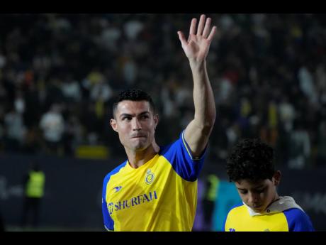 Cristiano Ronaldo reacts during his official unveiling as a new member of Al Nassr football club in in Riyadh, Saudi Arabiaon  Tuesday, January 3, 2023.