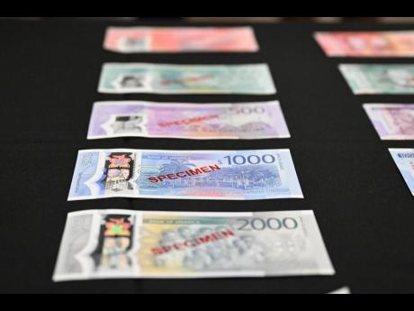 Samples of the new series of banknotes displayed at the Bank of Jamaica.