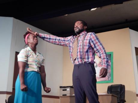 Pastor Banks, played by Dennis Titue, attempts to drive a demon out of Hopie, played by Rachael Allen, in a scene from the TK Dawkins-directed play, ‘No Hope for Hopie’.