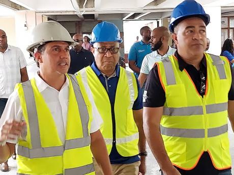 From left: Project manager and architect Vivian Gordon; St Andrade Sinclair, regional director of the Western Regional Health Authority; and Health and Wellness Minister Dr Christopher Tufton on a tour of the Cornwall Regional Hospital in Montego Bay, St J