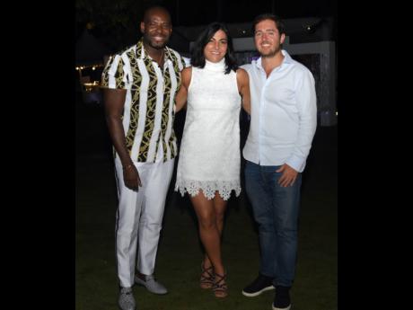 Garfield Collins (left), regional sales manager, Couples USA, and Abe Issa, president of sales and marketing, Couples Resorts, flank the lovely Pauline Pigott, vice-president, sales and marketing, Couples Resorts.Ashley Anguin/Photographer