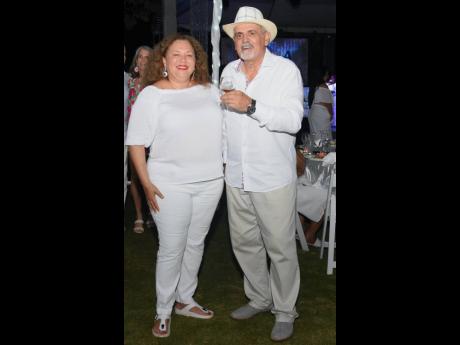 Jan Pollack, chief financial officer, Couples Resorts, shares lens with Pierre Battaglia, general manager, Couples San Souci, who is looking every bit large and in charge in a fedora.