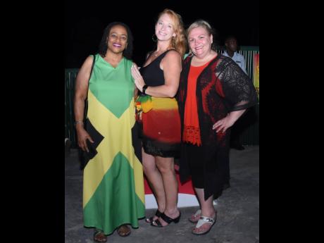 Andrea Chase (left), of the Jamaica Tourist Board Miami, was in good company as she posed with travel agents Robyn Hall and Irene Sauger (right).