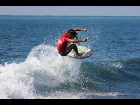 Elishama Beckford pulls off an aerial manoeuvre on his way to winning the Jamaica Surfing Association’s opening qualifier at Makka Beach in St Thomas at the weekend.