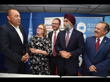 Dr Christopher Tufton (left), minister of health and wellness, thanks (from second left): Emina Tudakovic, High Commissioner of Canada to Jamaica; Vicente Teran, acting country representative for UNICEF Jamaica; Harjit Sajjan, Canada’s minister of intern