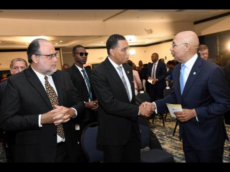 Governor General Sir Patrick Allen (right) greets Prime Minister Andrew Holness (centre) and Opposition Leader Mark Golding at the 43rd Annual National Leadership Prayer Breakfast at The Jamaica Pegasus hotel in New Kingston on Thursday.