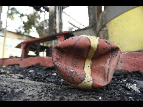 In this 2018 photo a deflated basket ball  sits at burnt out Walkers Place of Safety children’s home on Lyndhurst Crescent in Kingston.