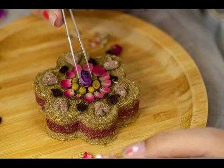 Cofounder Donna Li makes a rabbit grass cake at the Bunny Style Hotel in Hong Kong.