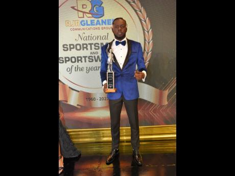 
Rasheed Broadbell shows of his 2023 Sportsman of the Year award during the RJRGLEANER National Sportsman and Sportswoman of the Year Award ceremony at The Jamaica Pegasus on Friday.