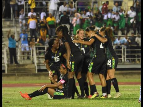 Reggae Girlz celebrate after scoring against  Paraguay during an international friendly match at the Catherine Hall Sports Complex on Thursday, November 10, 2022.