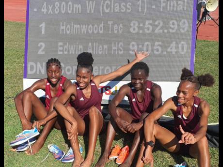 From left: Andrene Peart, Jodyann Mitchell, Christine Cheka and Cindy Rose celebrate their record breaking 4x800 metres run at the Central Hurdles and Relays meet at GC Foster College last Saturday.