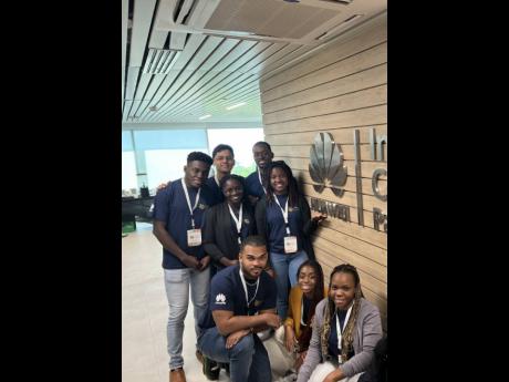 Jamaican students from the University of the West Indies, Mona, pose with Huawei ambassador and member of a past Seeds for the Future cohort Ernesto Briceno (centre, back) in the Huawei Innovation Center at MMG Tower in Panama City. 