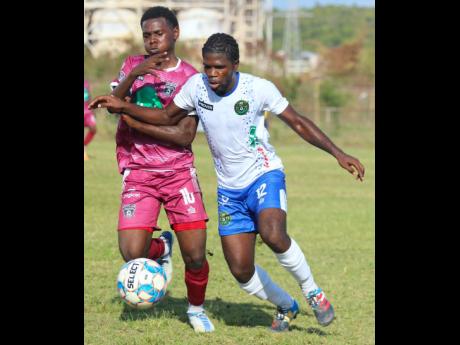 Theon Cupee (left) of Chapelton Maroons battles with Vere United’s Tavis Grant during their Jamaica Premier League encounter at the Wembley Centre of Excellence on Sunday, January 8, 2023.
