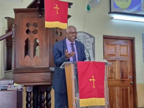 Reverend Davewin Thomas delivering his keynote sermon at the annual Jamaica Customs Agency church service, held at the Burchell Baptist Church on Sunday.