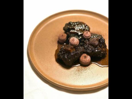 In the Dutch pot series, Chef Sanderson prepared a braised oxtail, which is a spiced oxtail just made with red beans, toasted pimento powder and topped with thyme oil.