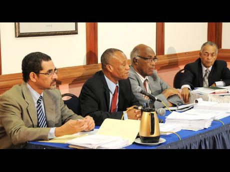 In this 2011 photo at the FINSAC Commission of Enquiry are (from left) Commissioner Charles Ross; Worrick Bogle, chairman of the FINSAC Commission; legal advisor Justice Henderson Downer and Fernando Deperalto, secretary of the FINSAC Enquiry.
