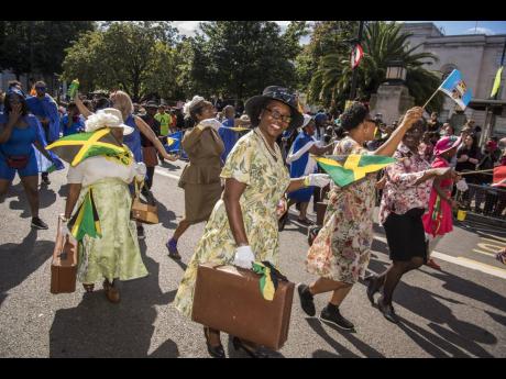 A Windrush Day street parade in Hackney, east London celebrates the Windrush generation.