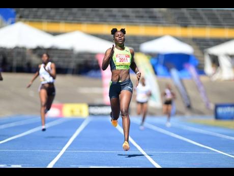 Shericka Jackson strides towards the finish line during a 400-metre heat at the Queens/Grace Jackson Meet on at the National Stadium in Kingston yesterday.