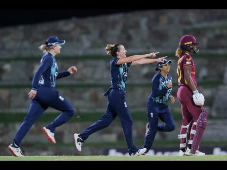 
England Women celebrate a wicket while West Indies captain Hayley Matthews (right) looks on during the third CG United One-Day International cricket match at the Sir Vivian Richards Stadium in Antigua and Barbuda on December 9.