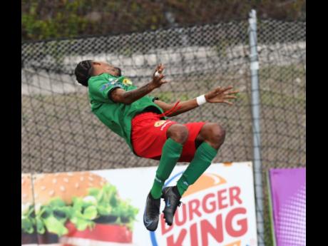 
Humble Lion player Shamari Dallas somersaults as part of a goalscoring celebration.