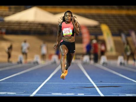 Elaine Thompson-Herah on her way to winning the women’s 60 metre at the Queens/Grace Jackson Meet at National Stadium in St Andrew yesterday.