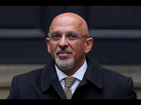 FILE - Conservative Party chairman Nadhim Zahawi leaves the Conservative Party head office in Westminster, central London, Tuesday. British Prime Minister Rishi Sunak has fired the chairman of his ruling Conservative Party chairman over a “serious breach
