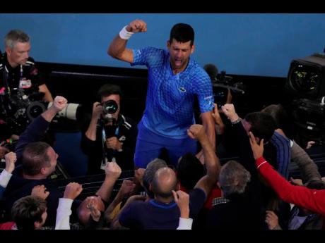 Novak Djokovic of Serbia celebrates after defeating Stefanos Tsitsipas of Greece in the men's singles final at the Australian Open tennis championships in Melbourne, Australia today.