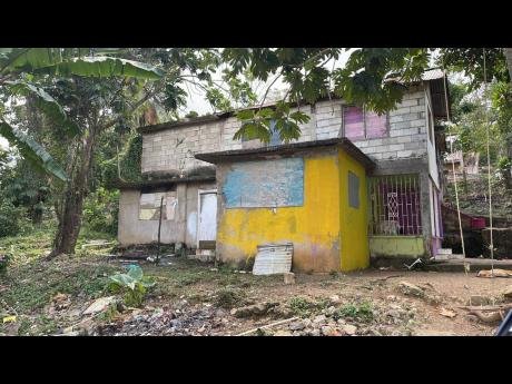 The family house where 19-year-old Noel Demetrius was allegedly killed by his 13-year-old sister during a domestic dispute this morning in Irwin, St James.