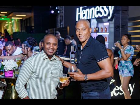 Kamal Powell (left), regional marketing manager for the Campari Group, distributors of Hennessy, and developer Leocroft Forden at the launch of The Greens. 