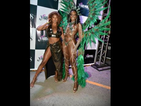 Trinidadian designer Nikitha Cornwall stands with her costume, Aja, modelled by former Miss World Trinidad and Tobago Athaliah Samuel.