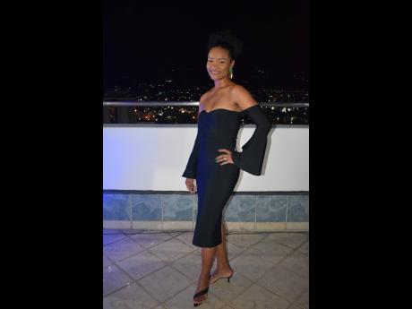 Nastassia Morrison, head of business development at RealDecoy Global Services, is simply chic in her tea-length black dress and stylish kitten heels.
