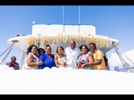 From left: Heather and Venessa, sisters of the bride; Sharon, mother of the bride; Krystal, the bride’s sister and Ravon, the bride’s brother were not about to miss out on the blissful boat wedding experience. 