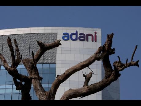 Dried branches of a tree stand outside Adani’s corporate offices in Ahmedabad, India, on Friday, January 27.