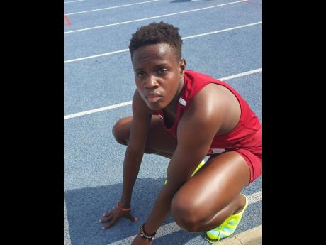 Holmwood Technical High’s captain Rickiann Russell recovers after her personal best 52.88 seconds in the Class One 400 metres at the Grace Jackson/Queens Invitational meet last Saturday. 