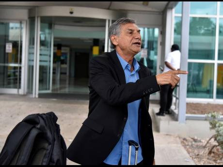 New Chapelton Maroons coach, Brazilian  Clovis de Oliveira, speaks to members of the media shortly after arriving in the island at the Norman Manley International Airport yesterday,