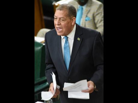 Audley Shaw, minister of transport and mining, addresses lawmakers on the roll-out of the new Road Traffic Act regime during the sitting of the House of Representatives on Tuesday.