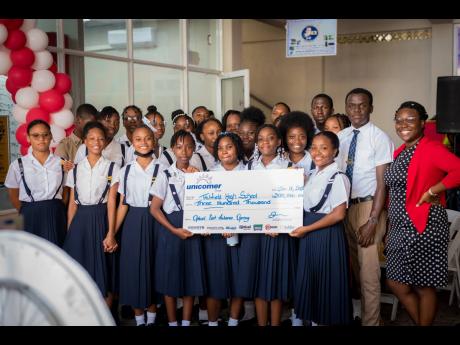 Courts Optical marked the launch of its 13th store in Port Antonio, Portland, with a donation of $300,000 to the Titchfield High School Choir. The donation will cover the cost of screening, testing and glasses for members of the school’s choir.