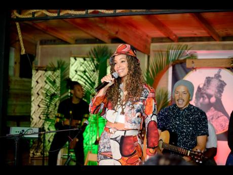 Host for the evening, Kamila McDonald, owner of Kamila’s Kitchen and one of Flair’s 23 Women to Watch in 2023, greets the enthusiastic audience in an eye-catching printed ensemble as guitar player Jason Wharton cheers her on.