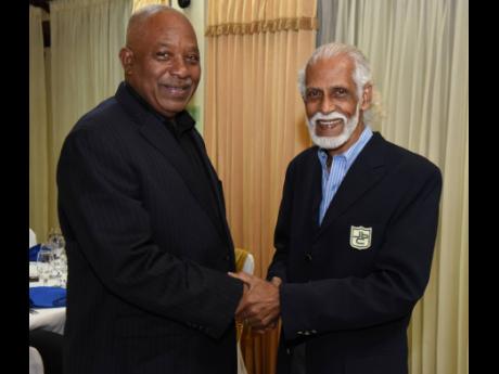 Veteran meets veteran as former TV broadcaster Tony Patel (right) greets Clevans Wilson, a long-time cameraman at Television Jamaica. They were attending a Veterans’ Luncheon hosted by the Press Association of Jamaica at Alhambra Inn in Kingston on Wedne