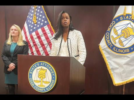 Cook County, Ill., State’s Attorney Kim Foxx (centre), announced on Monday, in Chicago that she is dropping sex abuse charges against singer R. Kelly. 