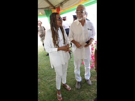 Carlene Davis and her husband, Tommy Cowan, decked out in white at the celebration of the 66th anniversary of Dennis Brown’s birth.