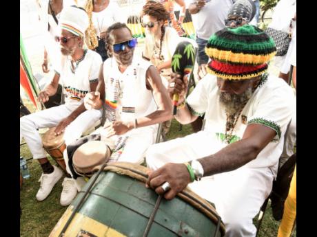 The Inna De Yard Binghistra Drummers performing during Dennis Brown’s 66th birthday anniversary celebration and wreath-laying. 