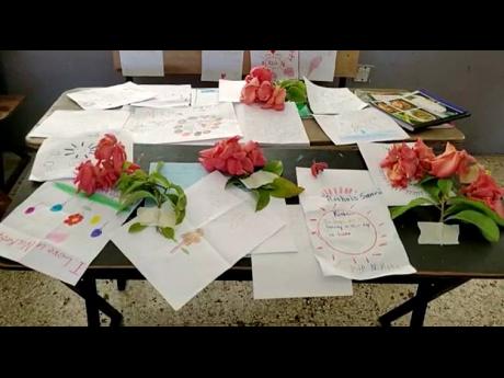 A table with tributes dedicated to nine-year-old Nikita Noel by her grade four classmates at Esher Primary in Lucea, Hanover.
